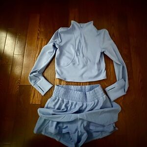 90 Degree By Reflex Ribbed Blue Half Zip Top & shorts attached to a skirt